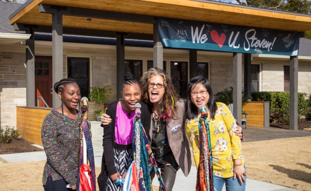 Steven Tyler stands together with girls from Janie's House at the official opening on February 6, 2019 on the Youth Villages' Bartlett, TN campus.